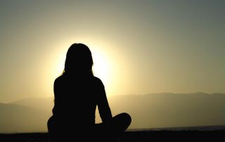 goodcenter Can Mindfulness Help Me Recover from Opioid Addictio photo of a woman meditating near the ocean